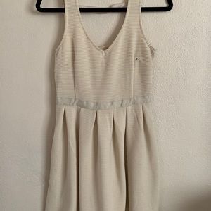 Sleeveless cream colored dress